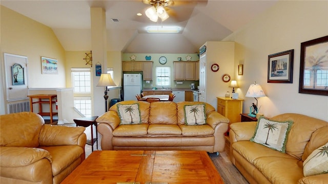 living room featuring visible vents, ceiling fan, lofted ceiling, and a healthy amount of sunlight
