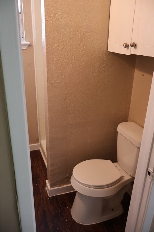 bathroom featuring toilet and hardwood / wood-style flooring