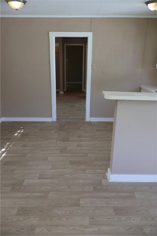 spare room featuring light hardwood / wood-style flooring