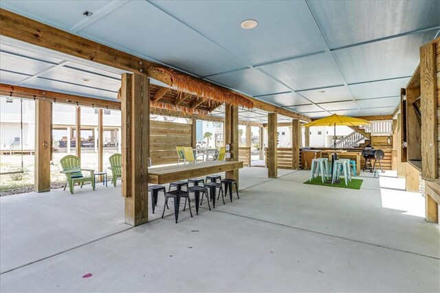 view of patio with outdoor dry bar