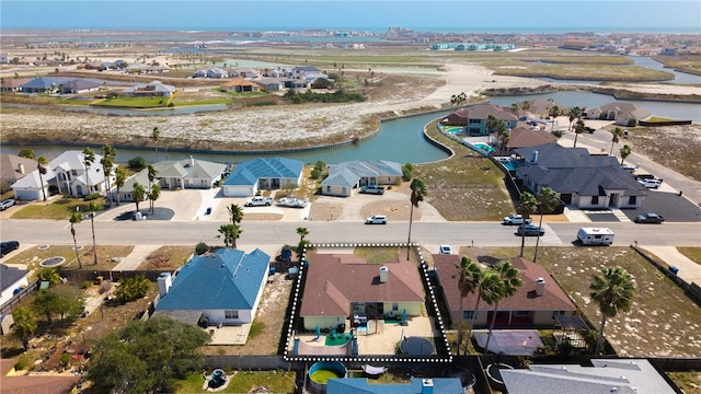 bird's eye view featuring a residential view and a water view