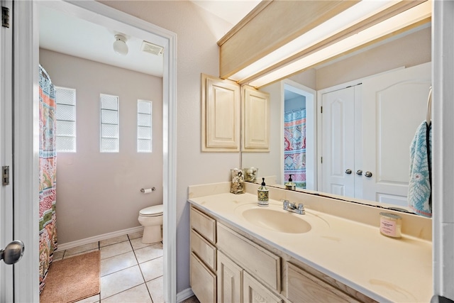 full bath with toilet, visible vents, baseboards, vanity, and tile patterned floors