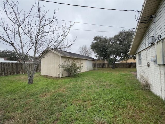 1203 N Hackberry St, Bishop, TX 78343 - view of yard with a fenced backyard and an outdoor structure