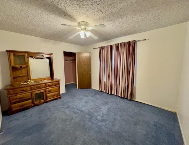 1203 N Hackberry St, Bishop, TX 78343 - unfurnished bedroom with a closet, a textured ceiling, baseboards, and ceiling fan