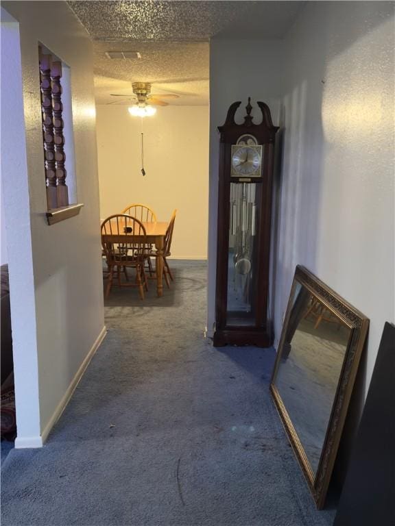 1203 N Hackberry St, Bishop, TX 78343 - hall with baseboards, a textured ceiling, and carpet