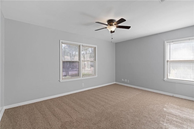 spare room with carpet and ceiling fan