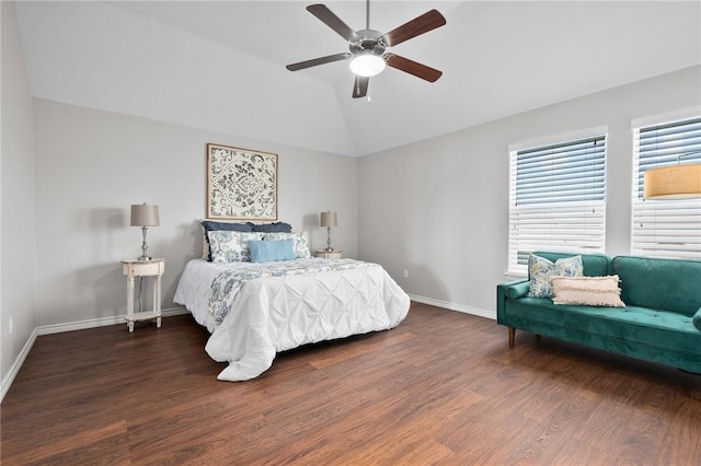 bedroom with lofted ceiling, a ceiling fan, baseboards, and wood finished floors