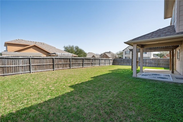 view of yard with a patio area and a fenced backyard