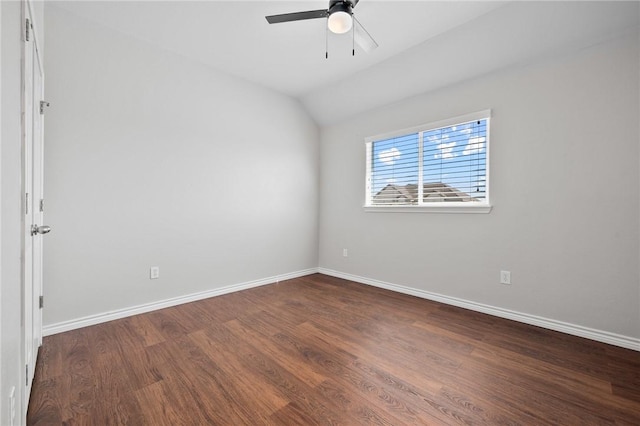 unfurnished room with dark wood-style floors, lofted ceiling, ceiling fan, and baseboards