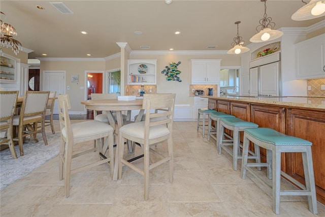 dining space featuring recessed lighting, visible vents, and ornamental molding