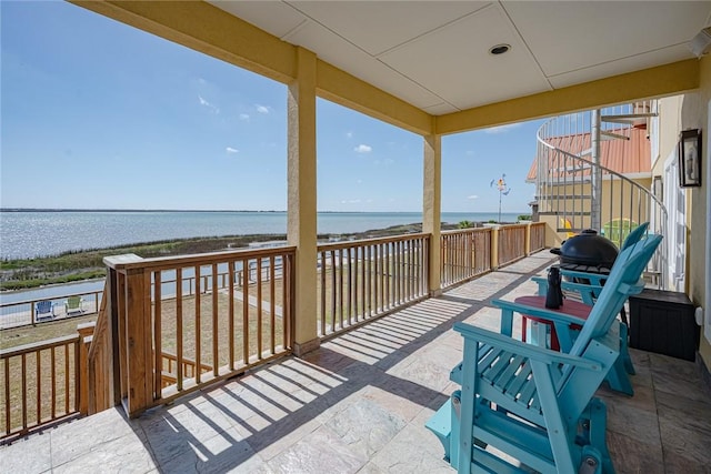 exterior space featuring a water view and stairs