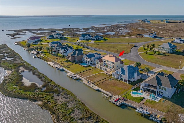 birds eye view of property featuring a water view and a residential view