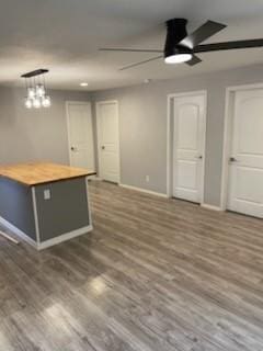 4414 Valdez Dr, Corpus Christi, TX 78416 - kitchen featuring a ceiling fan, baseboards, butcher block countertops, and wood finished floors
