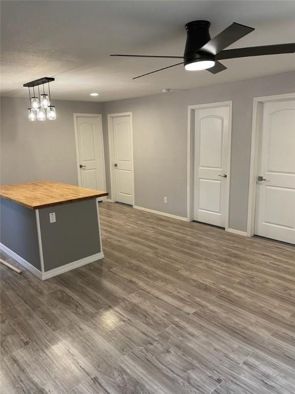 4414 Valdez Dr, Corpus Christi, TX 78416 - empty room featuring a ceiling fan, baseboards, and wood finished floors
