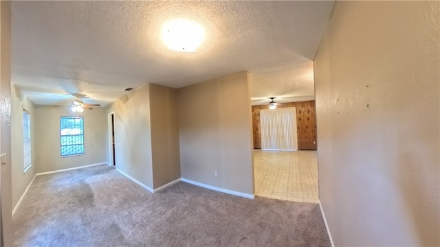 257 N 9th St, Aransas Pass, TX 78336 - spare room featuring ceiling fan, a textured ceiling, and carpet flooring