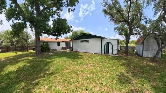 257 N 9th St, Aransas Pass, TX 78336 - rear view of property with a shed