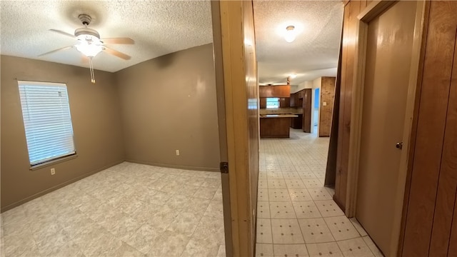 257 N 9th St, Aransas Pass, TX 78336 - unfurnished room featuring a textured ceiling and ceiling fan