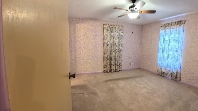 257 N 9th St, Aransas Pass, TX 78336 - unfurnished room featuring ceiling fan and carpet flooring