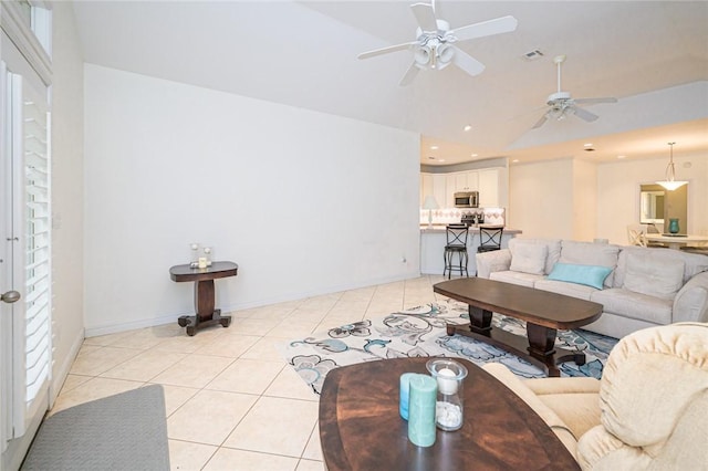 living area featuring visible vents, lofted ceiling, recessed lighting, a ceiling fan, and light tile patterned floors