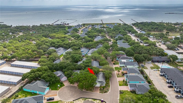 drone / aerial view featuring a water view and a residential view