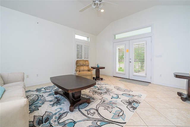 living room with french doors, a ceiling fan, baseboards, light tile patterned floors, and vaulted ceiling