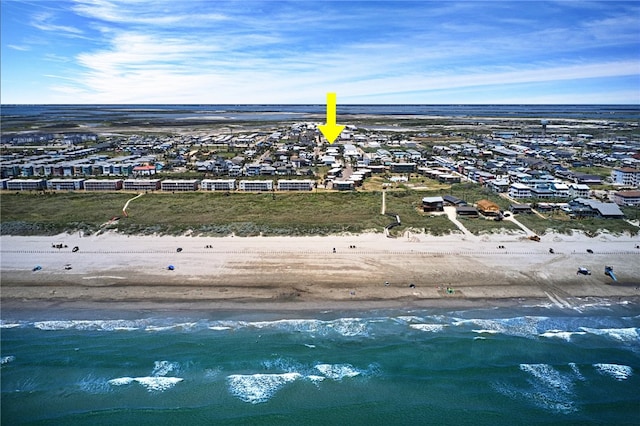 aerial view featuring a view of the beach and a water view