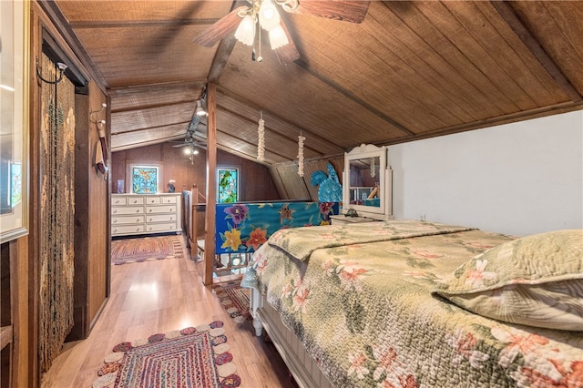 bedroom with wood walls, wood-type flooring, ceiling fan, and wood ceiling