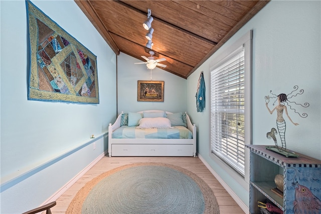 bedroom with track lighting, light hardwood / wood-style floors, lofted ceiling, wooden ceiling, and ceiling fan