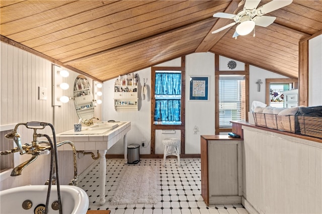 bathroom featuring wooden ceiling, ceiling fan, a washtub, and lofted ceiling