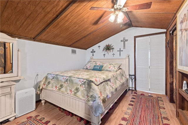 bedroom featuring wooden ceiling, ceiling fan, light hardwood / wood-style flooring, and lofted ceiling