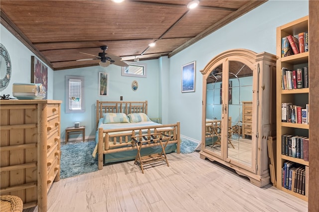 bedroom featuring wooden ceiling, light hardwood / wood-style floors, ceiling fan, and lofted ceiling