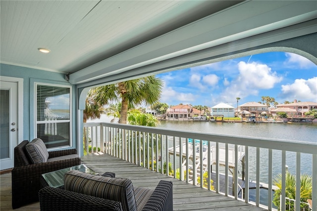 wooden deck with a water view