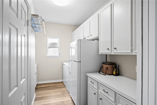 laundry room featuring light hardwood / wood-style flooring