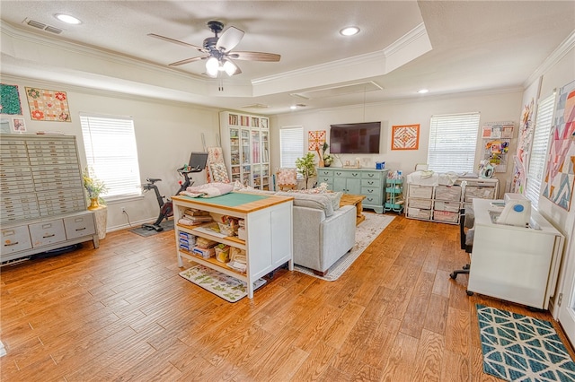 7710 Cisco, Corpus Christi, TX 78413 - living area featuring a tray ceiling, a ceiling fan, ornamental molding, light wood-type flooring, and recessed lighting