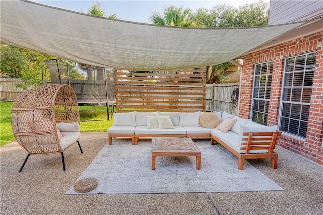 7710 Cisco, Corpus Christi, TX 78413 - fenced backyard with a trampoline, a patio area, and an outdoor hangout area