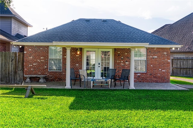7710 Cisco, Corpus Christi, TX 78413 - rear view of property with brick siding, a shingled roof, and french doors