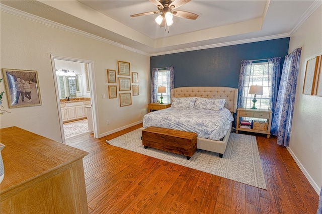 7710 Cisco, Corpus Christi, TX 78413 - bedroom featuring hardwood / wood-style flooring, multiple windows, a raised ceiling, and crown molding