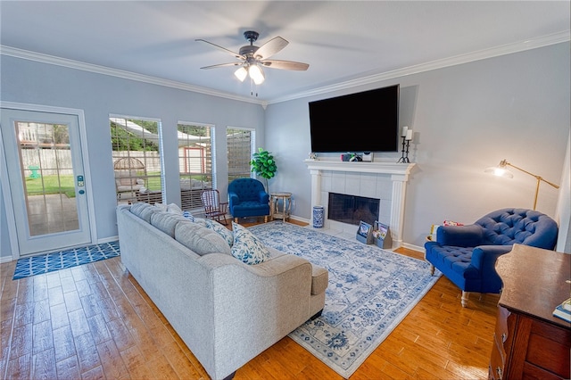 7710 Cisco, Corpus Christi, TX 78413 - living room with ornamental molding, healthy amount of natural light, wood finished floors, and ceiling fan