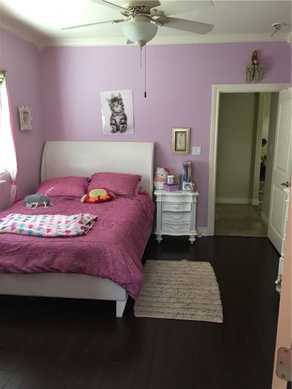 bedroom with hardwood / wood-style floors, ceiling fan, and ornamental molding