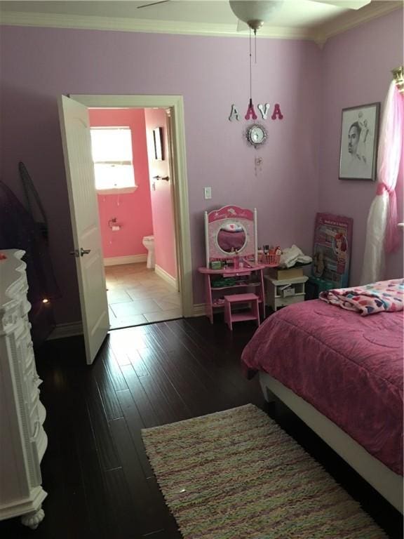 bedroom with hardwood / wood-style floors and ornamental molding