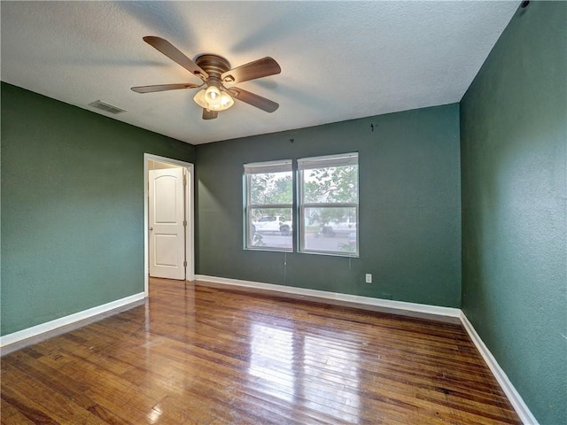 1809 Merriman Ave, Corpus Christi, TX 78412 - spare room with hardwood / wood-style flooring, ceiling fan, baseboards, and visible vents