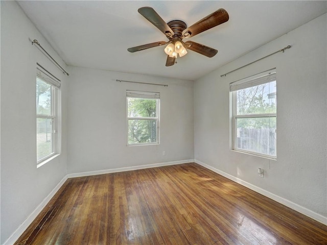 1809 Merriman Ave, Corpus Christi, TX 78412 - unfurnished room with hardwood / wood-style floors, plenty of natural light, a ceiling fan, and baseboards