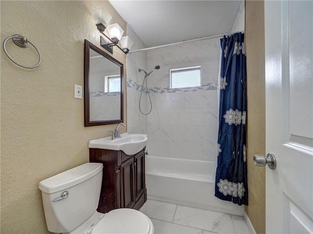 1809 Merriman Ave, Corpus Christi, TX 78412 - bathroom featuring shower / bath combo, toilet, marble finish floor, a textured wall, and vanity
