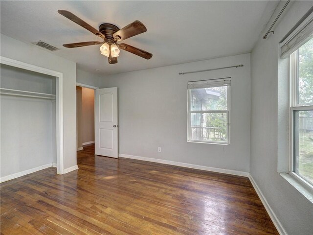 1809 Merriman Ave, Corpus Christi, TX 78412 - unfurnished bedroom with a closet, wood finished floors, visible vents, and baseboards
