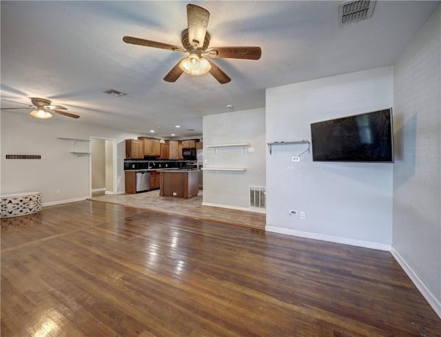 1809 Merriman Ave, Corpus Christi, TX 78412 - unfurnished living room featuring baseboards, a ceiling fan, and visible vents