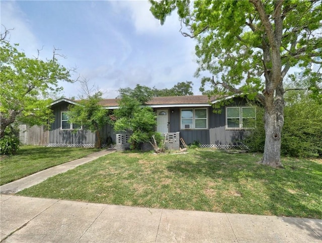 1809 Merriman Ave, Corpus Christi, TX 78412 - view of front of house with board and batten siding and a front yard