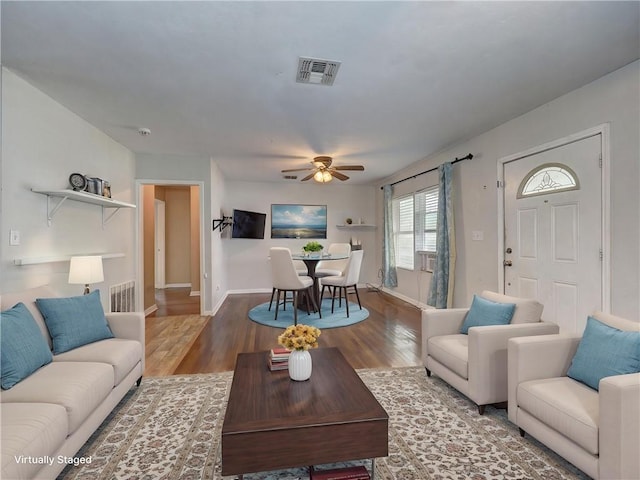 1809 Merriman Ave, Corpus Christi, TX 78412 - living room featuring wood finished floors, visible vents, a ceiling fan, and baseboards