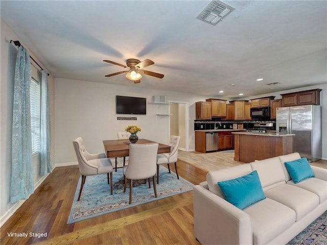 1809 Merriman Ave, Corpus Christi, TX 78412 - dining room featuring light wood finished floors, baseboards, visible vents, recessed lighting, and a ceiling fan