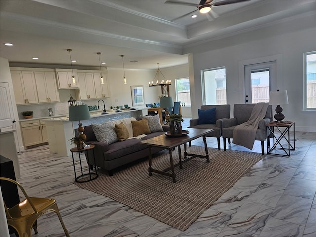 7713 Sophia Dr, Corpus Christi, TX 78414 - unfurnished living room featuring visible vents, crown molding, a tray ceiling, and ceiling fan