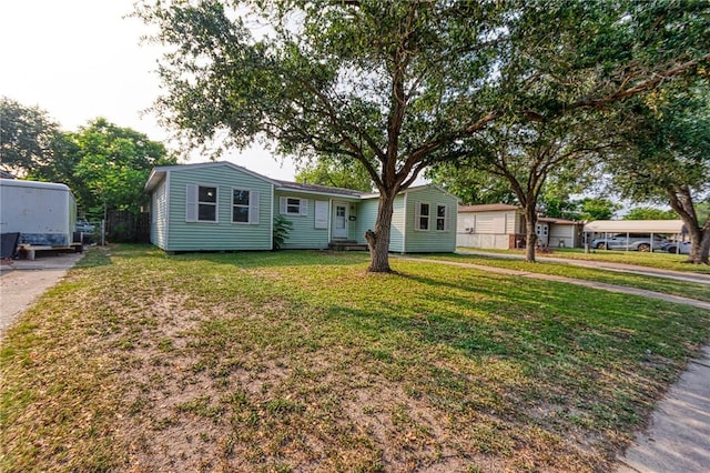 1309 Annapolis Dr, Corpus Christi, TX 78415 - view of front of home with a front lawn